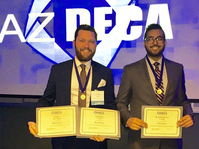 Ryan Evans (left) won first place in accounting while Neil Advani earned top honors in retail management.                                               