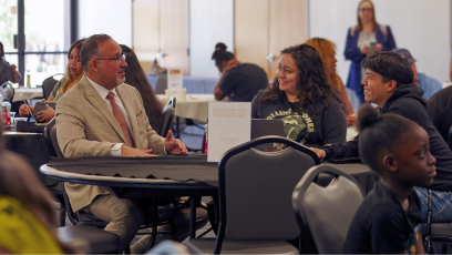 U.S. Secretary of Education Dr. Miguel A. Cardona meets with South Mountain Community College students during the college's FAFSA workshop