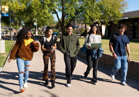 A group of students walking across the campus.