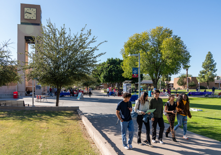 a group of Mesa Community College student walking across campus