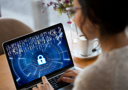 Image of a woman holding a tablet with a cybersecurity lock