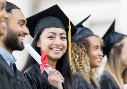 Image of graduates and a woman smiling holding up a diploma